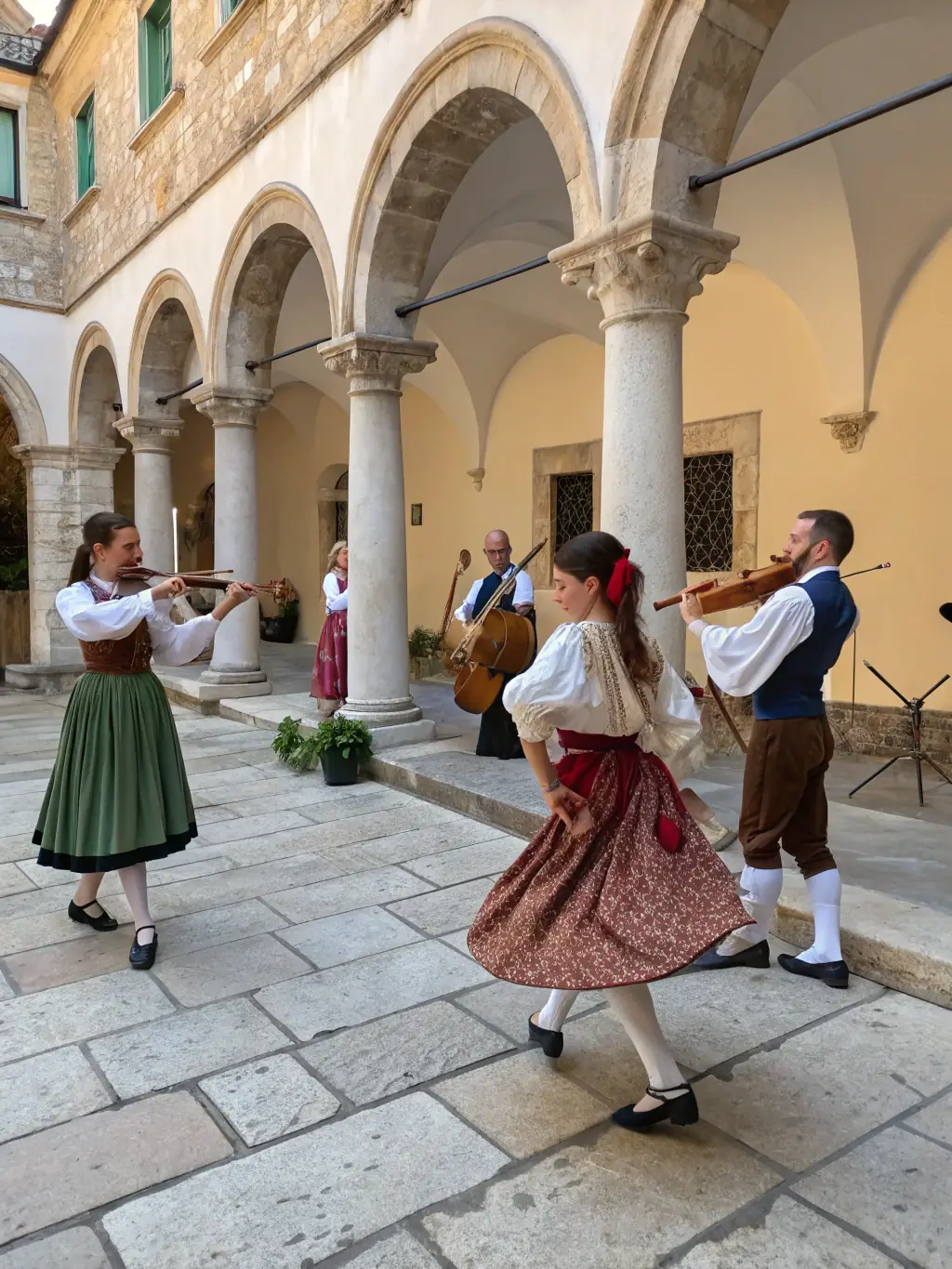 A picture of musicians playing traditional instruments at a cultural festival, showcasing LES AMIS D'OSMONDE's support for diverse musical traditions.